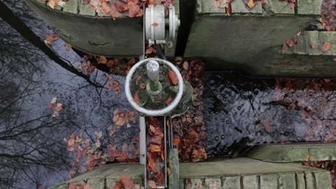 Old metal water lock construction with water passing through Stock Footage 200807497