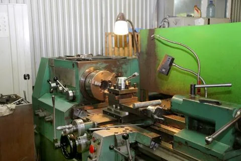 Old metal working lathe, made in the middle of the last century, is still in Stock Photos