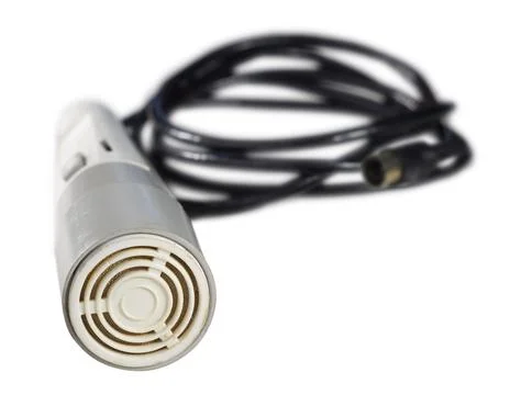 Old microphone with black wire. Isolated on white background Stock Photos