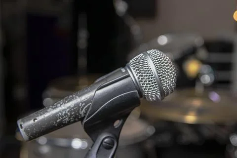 Old microphone. Blurred background. Stock Photos