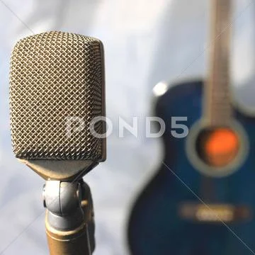 Old microphone with guitar Stock Photos