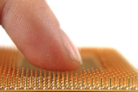 Old microprocessor and human hand Foto stock