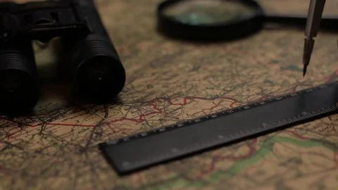 Old military map with binoculars, divider anr ruler Vidéo 72471580