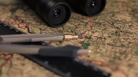 Old military map with binoculars, divider anr ruler Stock Footage 72471585