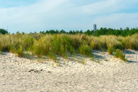 Old military observation tower on the beach of Hel, Poland. Sandy beach with Stock-Fotos