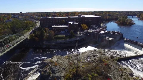 An Old Mill Flanked by a Bridge and a Dam Video stock 97534374