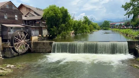Old Mill Restaurant in Pigeon Forge, Tennessee with rustic wooden waterwheel in Stock-Footage 341023629