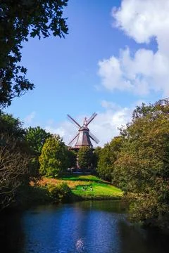An old mill by a scenic river surrounded by nature Foto stock