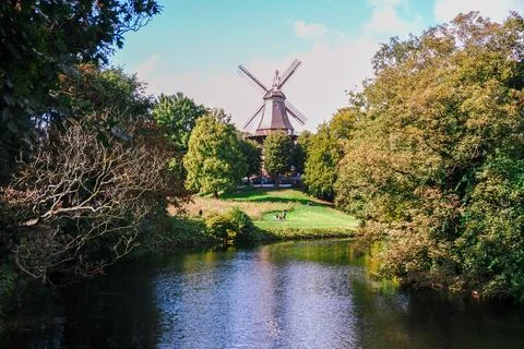 An old mill by a scenic river surrounded by nature Stock Photos