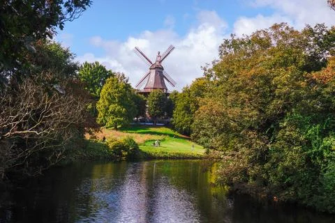 An old mill by a scenic river surrounded by nature Stock Photos