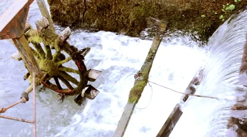 Old Mill Wheel in Front of a Waterfall in Close Up Stock Footage 61122380