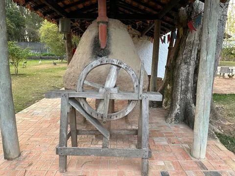 Old millstone in a rustic setting Stock Photos