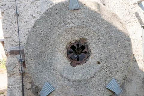 Old millstone on the wall Stock Photos