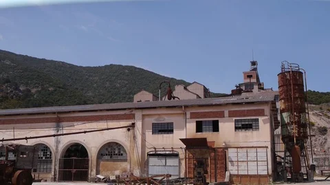 Old mine silos buildings rust broken glasses sardinia static Stock Footage 94878308