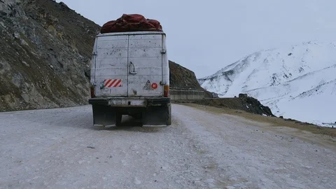 Old mini bus in snowy mountain Salang Afghanistan Stock Footage 128014564