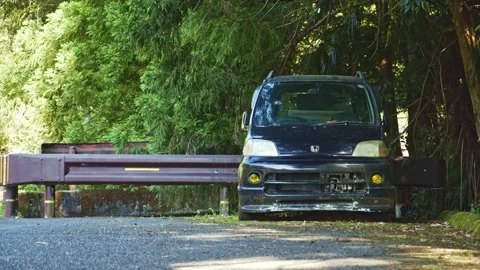 An old minicar abandoned on a forest road Video stock 134229802