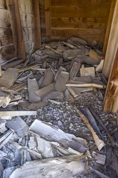 Old mining cabin filled with broken boxes and ore sample pieces Stock Photos