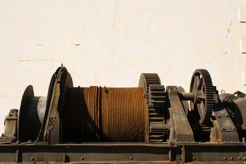 Old mining gears used to pull a steel cable. Stock Photos