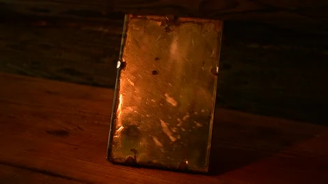 Old mirror in the flickering light of the flames Stock Footage 138145892