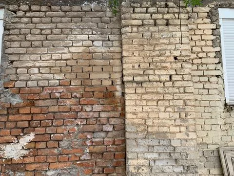Old Mixed Brick Wall with Weathered Texture Stock Photos