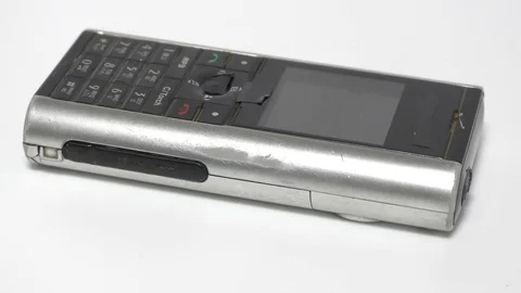 An old mobile phone with keypad on the surface moving Video stock 111887838