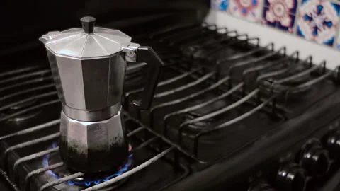 Old moka pot brewing coffee Stock Footage 159565657