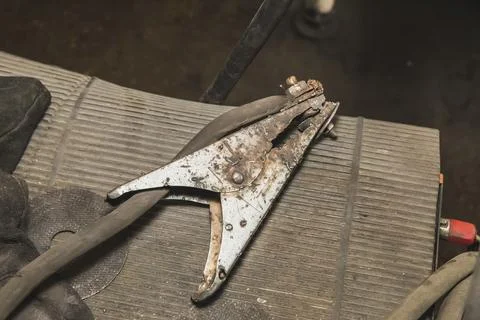 Old molten claw for semi-automatic welding machine Stock Photos