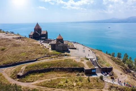 Old monastery on background of lake Sevan Stock Photos