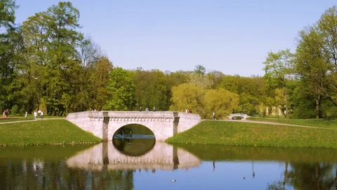Old monumental stone bridge over the pond Stock Footage 112283789