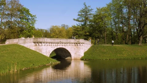 Old monumental stone bridge over the pond Stock Footage 112283790