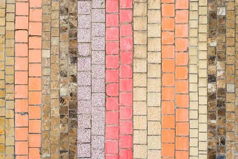 Old mosaic vertical striped pattern, shabby small ceramic colorful tiles Stock Photos