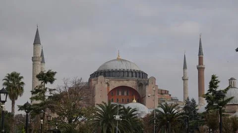 Old mosque surrounded by palm trees in turkey Stock Photos
