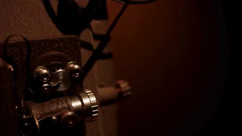 Old motion picture projector working in dark studio room Stock Footage 329743886