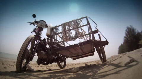 Old Motorcycle on a beach, Wide Angle Stock Footage 39655292