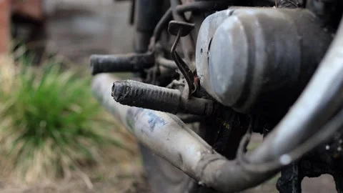 Old motorcycle in the dust. Red retro moto. Defective motorcycle, needs repair Stock Footage 269701356