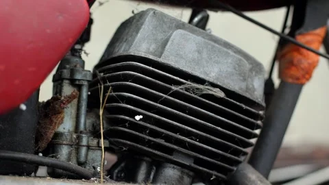 Old motorcycle in the dust. Red retro moto. Defective motorcycle, needs repair Stock Footage 269701367