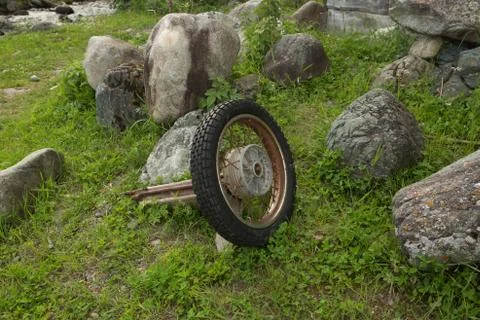An old motorcycle wheel with a frame.Accident consequences Stock Photos