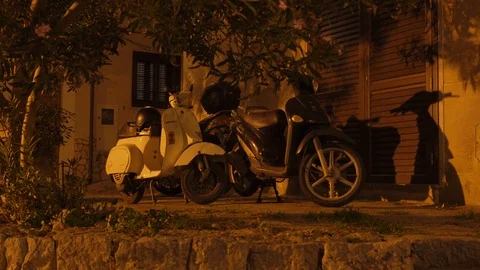 Old Motorcycles parked in Cefalu Stock Footage 88537296