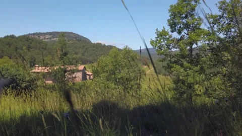 Old mountain brick house seen from the vegetation Stock Footage 134601449