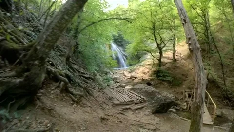 Old mountain path to the waterfall. Video stock 84790609