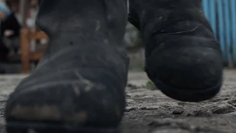 Old muddy boots closeup Stock Footage 76036095