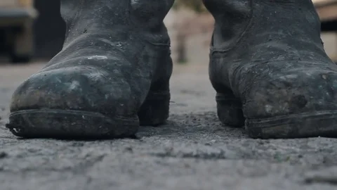 Old muddy boots closeup Stock Footage 76036369