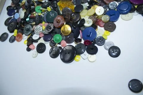 Old multi-colored plastic buttons for clothes Stock Photos