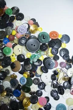 Old multi-colored plastic buttons for clothes Stock Photos