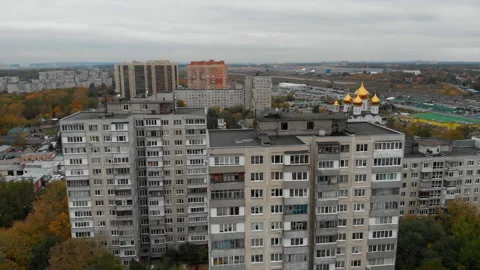 Old Multi-storey panel houses. building of the USSR with church background. Stock Footage 162170348
