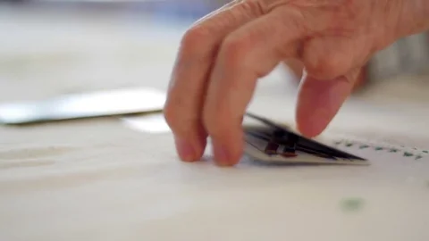 Old mutilated man's hands playing cards Video stock 76556951