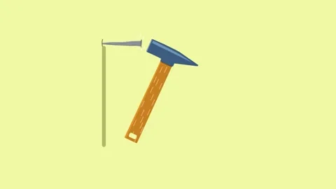 An old nail is driven into the wall with a large hammer with a wooden handle Vidéo 130621925