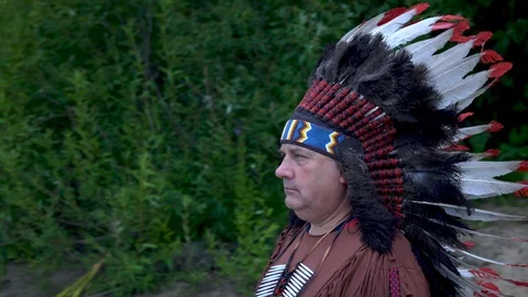 Old Native American Indians stands on the background of the river Background of Stock Footage 113356679