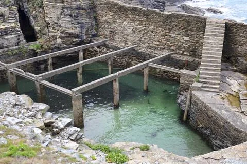 Old natural for breeding shellfish in Rinlo town, a small fishing village o.. Stock Photos