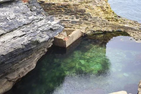 Old natural pool for breeding shellfish in Rinlo town, a small fishing vill.. Stock Photos